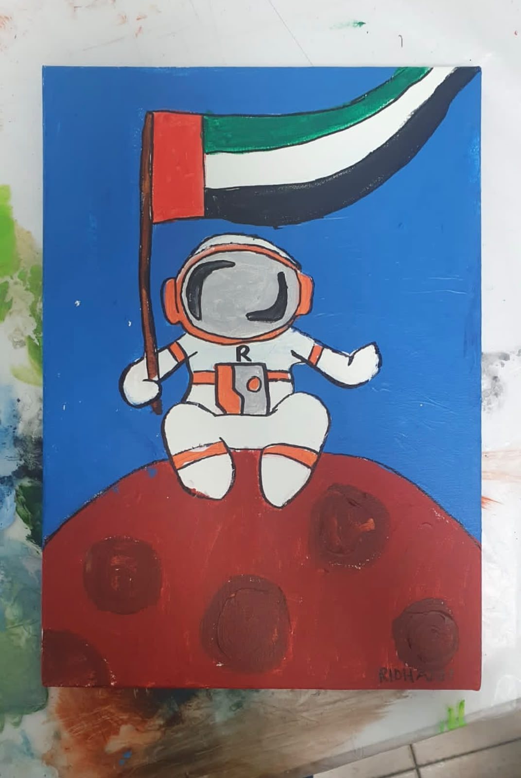 Painting of an astronaut holding the UAE flag on the surface of Mars