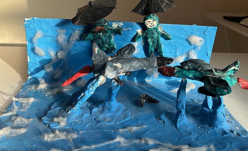 Painted model scene over blue water